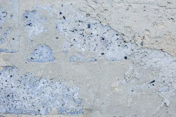 gray concrete wall, stucco, rough stone, with holes and irregularities