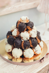 delicious eclair cake coated with white and chocolate icing