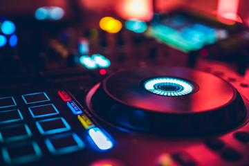 Obraz na płótnie Canvas DJ playing music at mixer club. Closeup. Party.