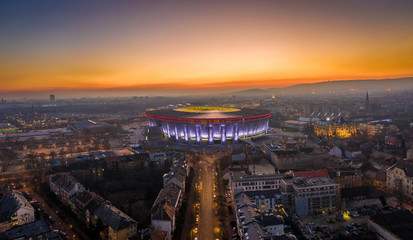 Budapest, Hungary - Aerial high resolution panoramic shot of Budapest at dusk with a beautiful golden sunset and Puskas Ferenc Stadium aka Puskas Arena