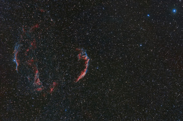 Photo of a cosmic nebula taken through a telescope. cosmic nebula NGC 6960. Space nebula between...