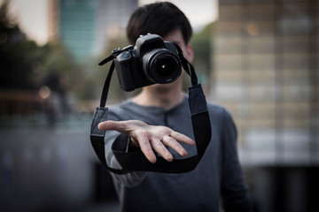 Photographer showing absolute control of his camera through levitation
