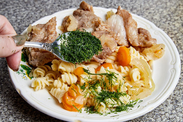 Cooking. Grilled meat on a plate with garnish and tomatoes