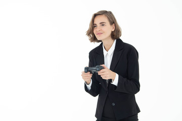 Fototapeta premium Young business woman is playing a video game on white isolated background.