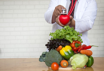 Healthy food and clean concept, hands doctor with vegetables