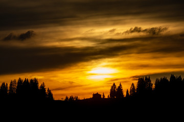 Fototapeta na wymiar Sunset over Alpine Trees near Morzine, France.