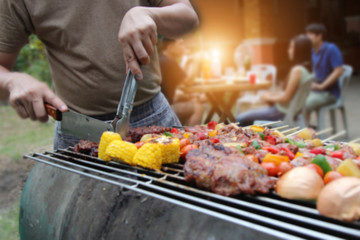 Barbeque Grill Street Food in thailand,Eat outdoors in a happy family.