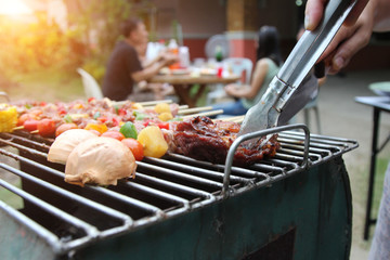Barbeque Grill Street Food in thailand,Eat outdoors in a happy family.