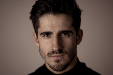 Young attractive latin man posing looking sensual and handsome. Beauty concept and lifestyle