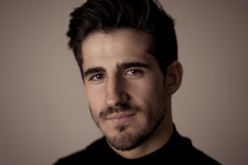 Young attractive latin man posing looking sensual and handsome. Beauty concept and lifestyle