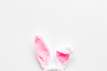 Easter bunny's ears on white background top-down copy space