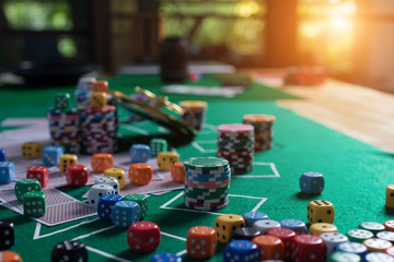 Casino equipment placed on the green floor for risky gambling for the people who want to get rich.