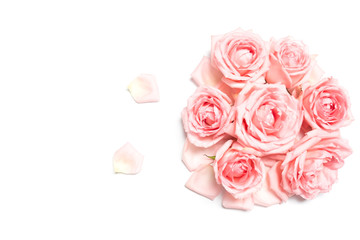 Bouquet of light pink rose flowers on white background with space for text.Top view.
