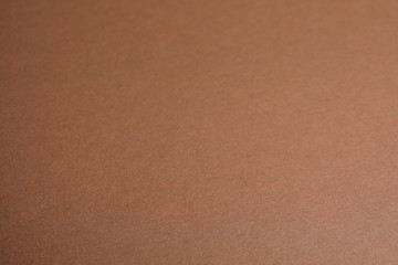 Brown sheet of cardboard as background, closeup