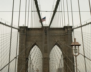 Brooklyn Bridge central arches and flag