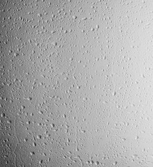 Rain drops on glass against light background
