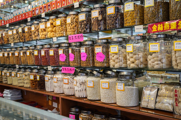 showcase of cans of bulk dry products by weight in a Chinese store