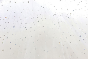 Vintage white tulle chiffon with silver sparkle stars texture background. wedding concept