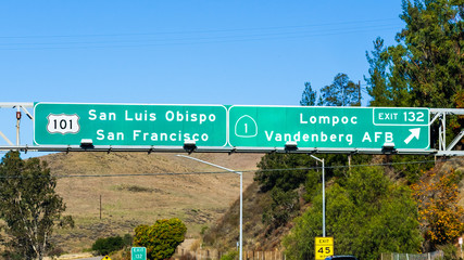 Highway 101 navigational road signage providing guidance towards San Luis Obispo / San Francisco and Lompoc / Vandenberg AFB (exit 132) ; California