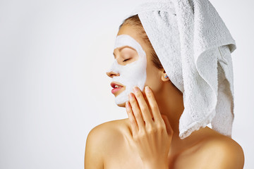Cosmetology, skin care, face treatment, spa and natural beauty concept. Woman with facial mask.