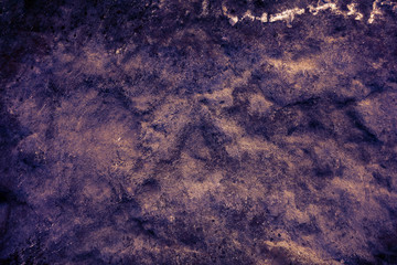 ancient dark purple granite stone surface of cave for interior