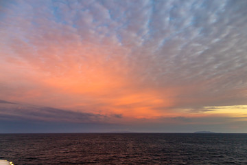 Pink Sky Over the Ocean. Beautiful sky over the Ocean with several colors. Colorful dramatic sky with morning sunshine. Nature background