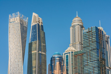 Fototapeta na wymiar Futuristic architecture of Dubai Marina buildings, Dubai, United Arab Emirates