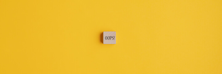 Oops sign over yellow background