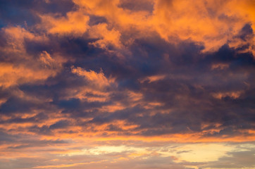 Obraz premium Cartoon orange and purple cumulus clouds. Close-up