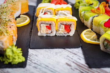 Sushi set on a black stone board. Japanese traditional food.