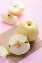 Fresh Asian pear fruit on pink background