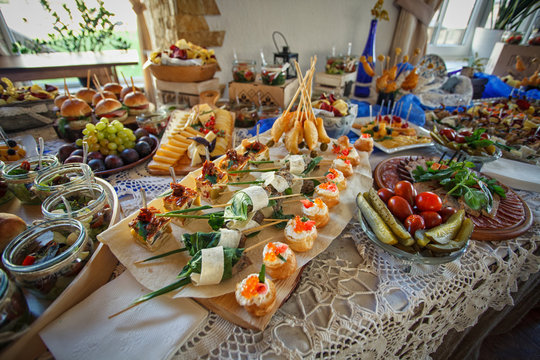 Beautifully decorated catering banquet table with different food snacks