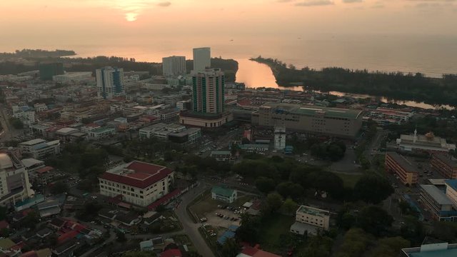 Aerial view sunset at Miri city, bay commercial area modern vehicle transport highway
