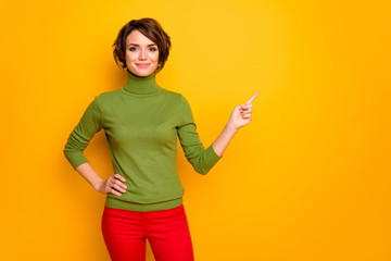 Photo of pretty sales manager lady self-confident person indicating finger empty space black friday...