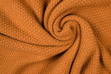 Brown knitted fabric pattern.