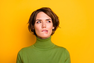 Closeup photo of amazing short hairdo lady biting lips looking up empty space have doubts deep...