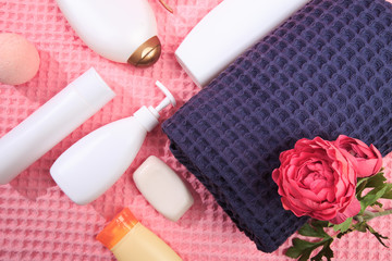 Folded soft towels and toiletries  - Image