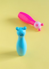 Vintage cute cats toy pink and blue on yellow background. Is it a boy or a girl concept.Baby announcement.