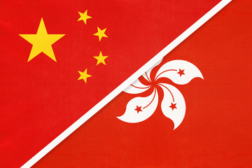 People's Republic of China or PRC vs Hong Kong national flag from textile. Relationship between two asian countries.