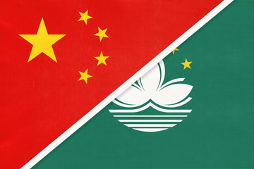 People's Republic of China or PRC vs Macao or Macau national flag from textile. Relationship between asian countries.