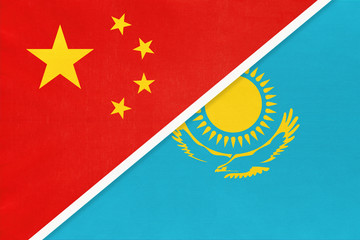 People's Republic of China or PRC vs Kazakhstan national flag from textile. Relationship between two asian countries.