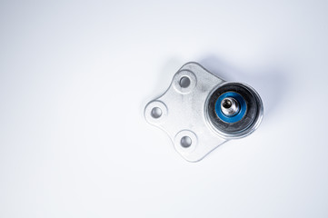 New spare parts spherical ball joints of a suspension bracket of a car on a gray background