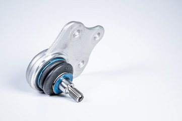 New spare parts spherical ball joints of a suspension bracket of a car on a gray background
