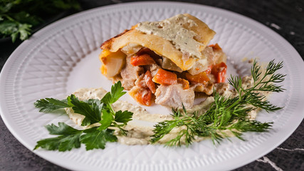 Food banner. Potato casserole with meat and vegetables, parsley, dill and sauce. Tasty and healthy food.