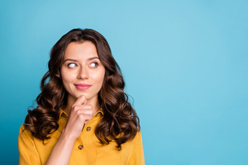 Photo of attractive curly lady in ponder mood looking empty space hold hand on chin interested wear...