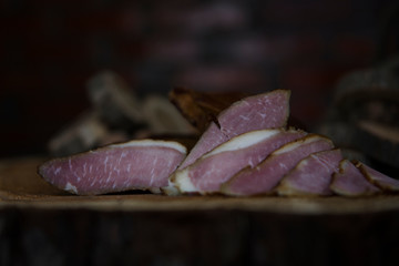Prosciutto Served on a Rustic Wooden Surface. Smoked Cured Ham, Delicious, Domestic, Traditional Food