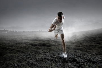 Fototapeta na wymiar Sportsman running race. Mixed media