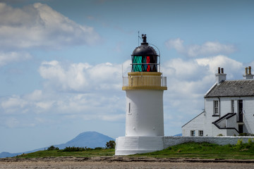 Fototapeta na wymiar White Corran Lighthouse bathed in summer sunshine