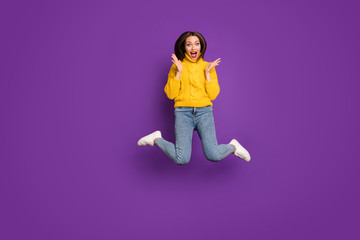 Fototapeta na wymiar Full length body size photo of ecstatic overjoyed woman in jeans denim unable to believe in sales starting tomorrow in white foot wear expressing emotions isolated bright color background purple