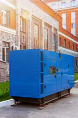 Diesel generator for emergency power supply at the wall of the medical center on a nice Sunny day. Close-up - obrazy, fototapety, plakaty